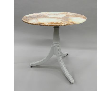 An onyx topped tripod table. 75 cm diameter.