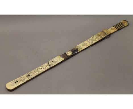 A 19th century Chinese sword with bone and horn handle, and a bone and horn mounted scabbard. 64 cm long.