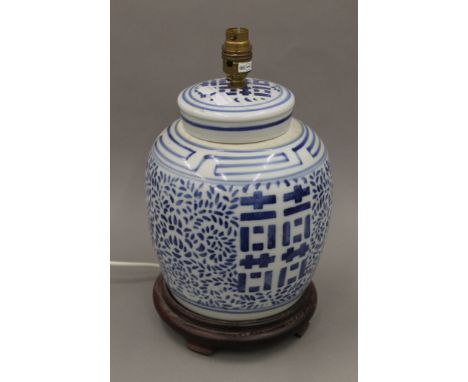 A Chinese blue and white ginger jar converted to a lamp. 35 cm high.