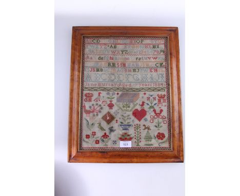 A Victorian gros point alpha-numeric woolwork sampler, bearing the date 1884 and the name of the author, Jane Murray age 7, t