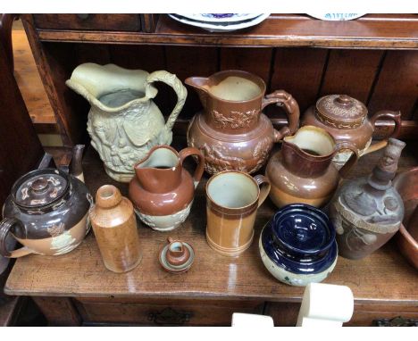 Group of salt glazed pottery, including jugs, teapots, Calvados flask, etc