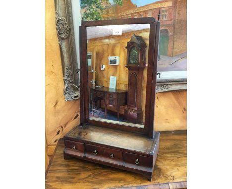 George III mahogany toilet mirror with rectangular plate above a plateau base containing three drawers, on bracket feet