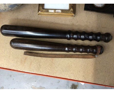 Two Metropolitan policeman's turned lignum vitae truncheons, for a Police Constable and Detective Constable (2)