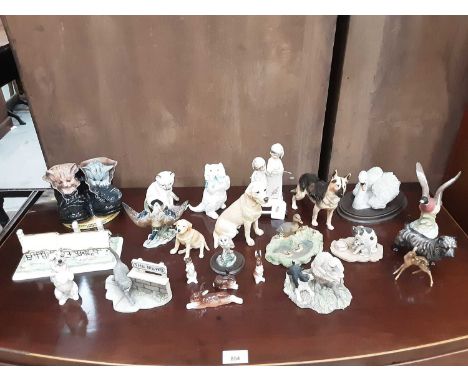 Selection of porcelain ornaments including Coalport cottage, three Royal Doulton dogs, two Royal Worcester cats, etc plus a f