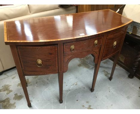 George III style inlaid mahogany bowfront sideboard with cross banded decoration and lion mask handles, on square taper legs 