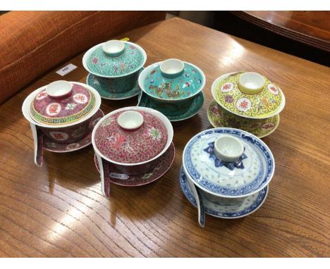 Six decorative Chinese porcelain rice cups, covers and stands, together with four rice spoons