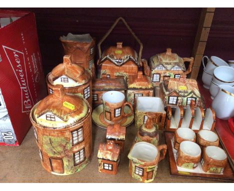 Group cottage ware to include storage jars, tea pot, jug, toast rack, egg cups etc