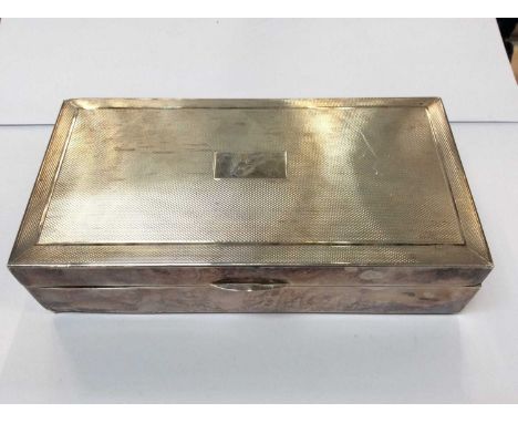 Silver cigarette box with engine turned decoration and engraved J initial. Birmingham 1951