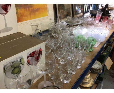 Large collection of glassware, including drinking glasses, bowls, dishes, etc