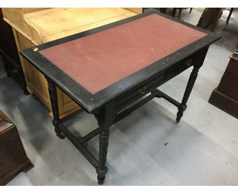 Late Victorian ebonised wood writing table with inset vinyl top, pair of draws, turned legs joined by stretcher, raised on ce