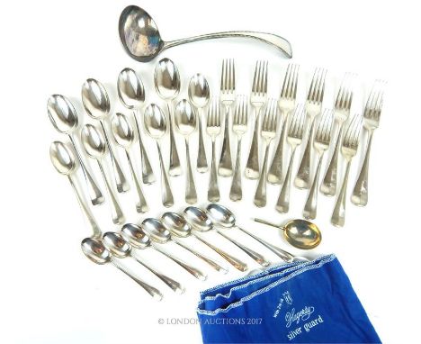 A collection of EP flatware including ladle, forks and spoons.