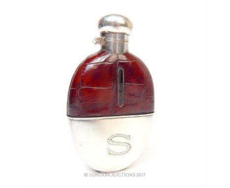 A vintage silver plated hip flask, bearing engraved "S" to detachable cup base; without internal stopper.