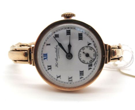 Thomas Russell &amp; Son; A Vintage 9ct Gold Cased Ladies Wristwatch, the signed white dial with black and blue Roman numeral