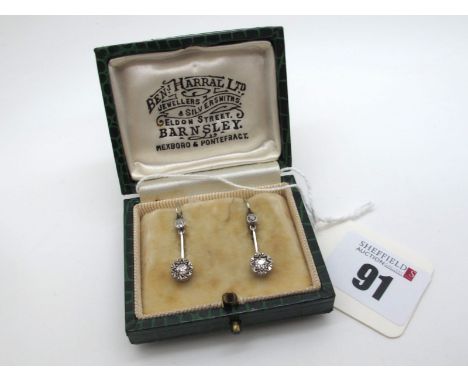 A Pair of Two Stone Diamond Set Drop Earrings, each old cut stone illusion set, on plain bar and collet set surmount and hook