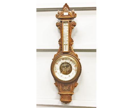 VICTORIAN CARVED OAK ANEROID WHEEL BAROMETER with thermometer dial, 92cm high