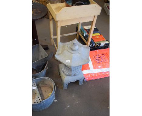 A reconstituted stone Japanese lantern on stand