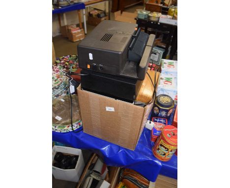 Box containing a slide projector and quantity of various slides