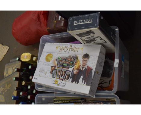 Box containing a large quantity of various games including Harry Potter Cluedo