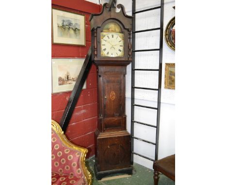 A Victorian oak inlaid longcase clock, curly pediment with carved paterae to hood, arched dial flanked by turned columns, pai