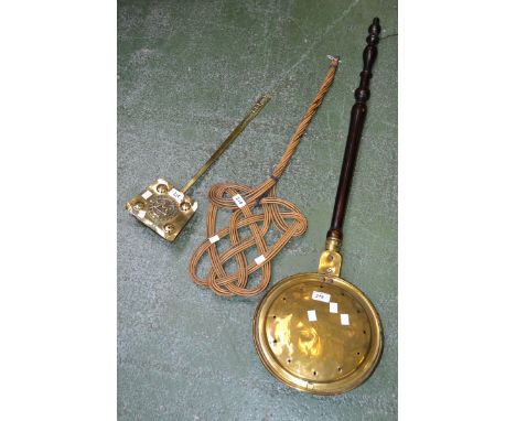 A brass chestnut roaster; a brass warming pan; a carpet beater (3)