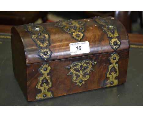 A Victorian dome topped walnut veneered tea caddy, pierced brass mounts, hinged cover, two partitions, circa 1850.