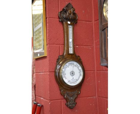 An oak banjo barometer.