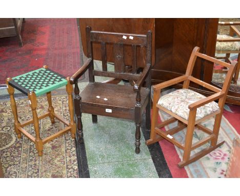 An oak child's elbow chair; a light oak child's rocking chair; a ropework seated stool (3) 