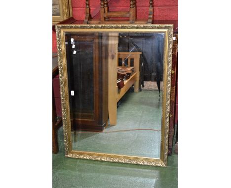 A contemporary gilt framed wall mirror, bevel edge glass. 100cm x 75cm (112cm x 87cm overall).