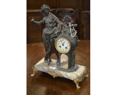 A late 19th century French spelter mantel clock, mounted with a classical female figure, Arabic numerals, twin winding holes,