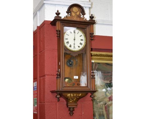 A 19th century continental Vienna wall clock, shaped and inlaid case, cream dial, Roman numerals, chiming movement, 