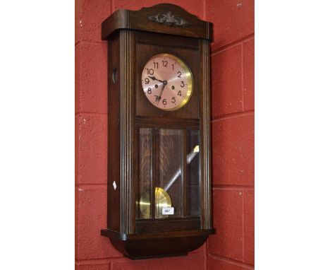 An oak wall clock, c.1930