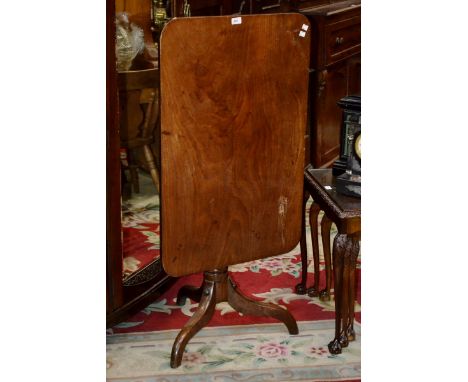 A Victorian mahogany tilt top table with turned column and tripod base c.1860