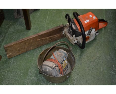 A Stihl MS290 petrol chainsaw; a Black and Decker sharpening stone; a brass cooking pot (3)