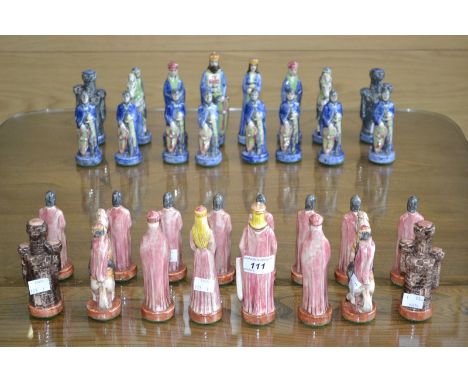 A set of ceramic chess pieces.