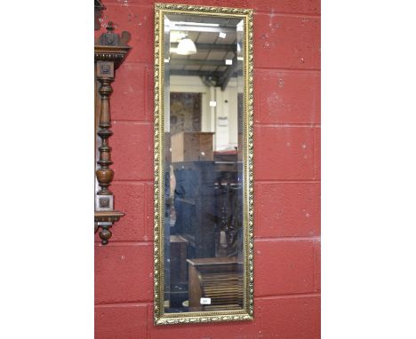 A rectangular gilt framed wall mirror.