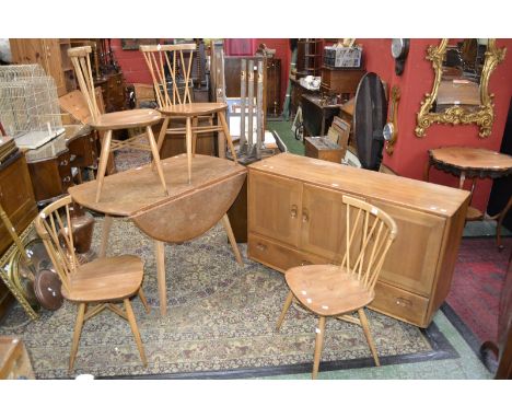 An Ercol dining room suite comprising four Ercol for John Lewis Chiltern dining chairs, crossed spindled backs and strechers,