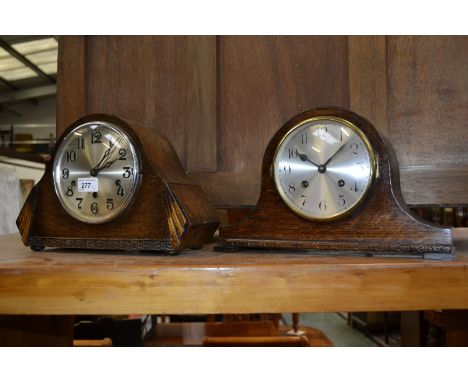 An oak mantel clock, Westminster chime, Arabic numerals; another similar oak mantel clock (2)