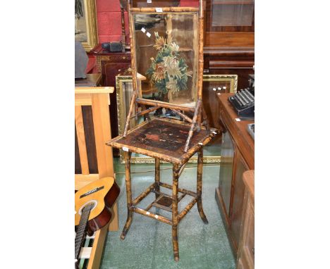 An oriental bamboo square occasional table painted flora and fauna; a conforming mirrored bamboo firescreen. (2)
