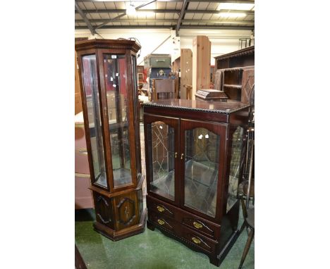 A Woodberry Bros. & Haines contemporary display cabinet, two glazed doors enclosing shelving over two long drawers; another t