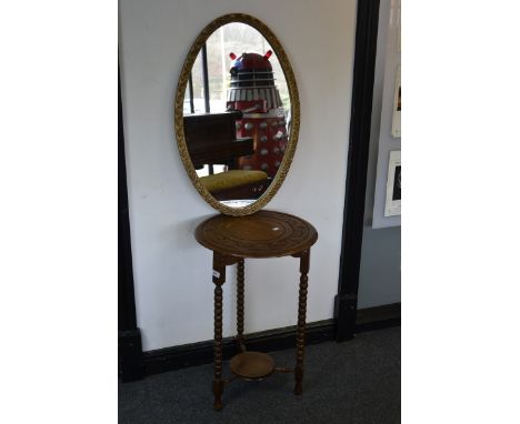 An oak occasional table with bobbin turned legs; a gilt framed mirror (2)