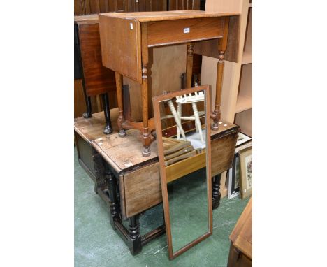 An early 18th century walnut drop-leaf table; a 1950's oak dropleaf occasional table; a mirror (3)