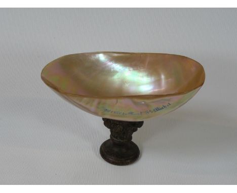 19thC Souvenir of a Mother of Pearl shell on carved column base 'Souvenir du Mont St Michel', 10cm in Height. 
