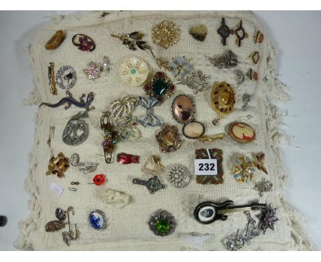 Large Cushion of assorted Costume Brooches 