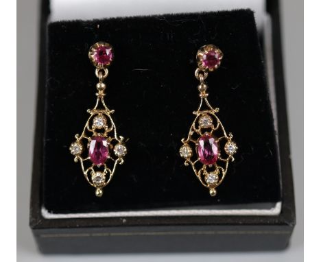 Pair of ruby and diamond gold set earrings 