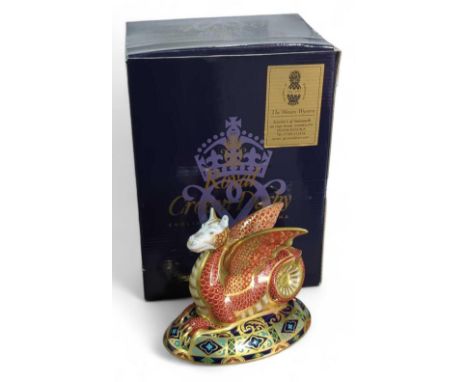 A Royal Crown Derby "Wessex Wyvern" paperweight of 2005, with red and gold scales and a floral pied design at the base. 13cm 