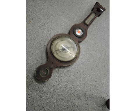 An antique barometer of banjo design by James Dee of Skipton local makers