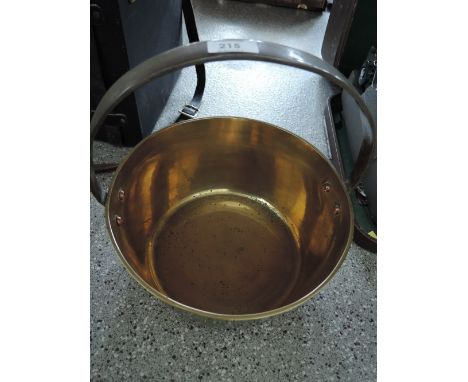 A vintage brass and cast handle jam pan