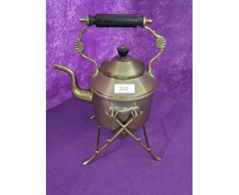 A vintage brass cast portable kettle and stand 