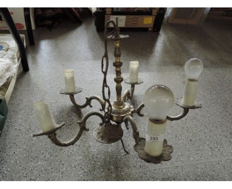 A brass five candle light fitting 