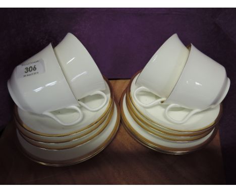 A selection of tea cups and saucers by Minton in the Horizon pattern